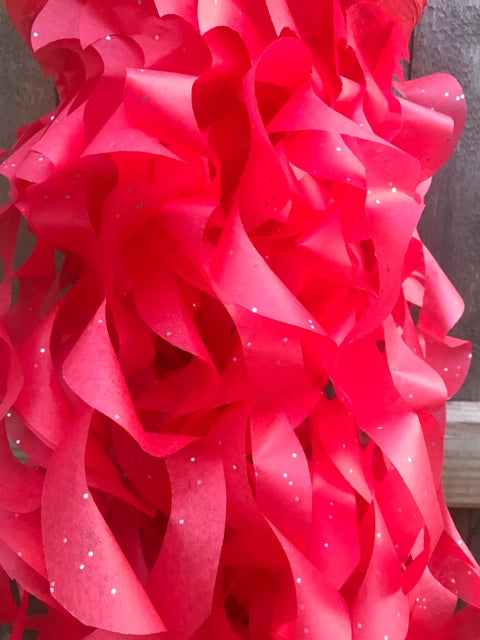 red tissue paper swirls