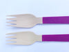 purple painted wooden forks