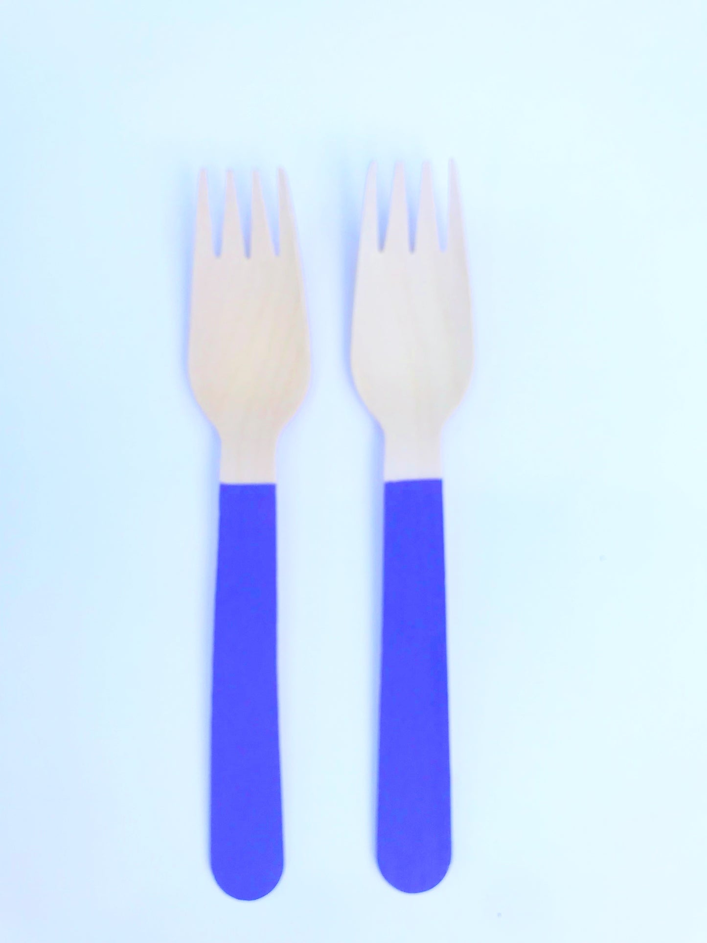 purple wooden forks