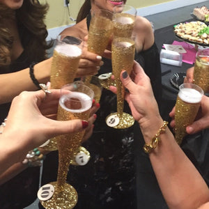 gold plastic champagne glass toast