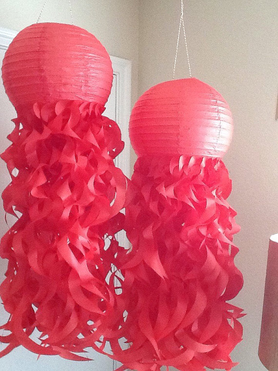 red paper jellyfish lanterns made with 100% recycled fiber