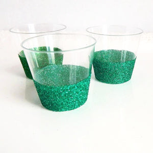 Green glitter plastic shot glasses for parties and events