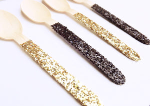 mini wooden spoons in black and gold glitter